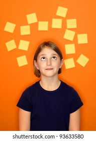 Young girl with sticky notes around her head representing her thoughts
