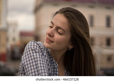 Young girl in the streets of the big city.Beautiful brunette.Wind in hair.Fashion portrait of stylish trendy woman.Outdoor portrait of beautiful teenage in black and white. - Shutterstock ID 466137128