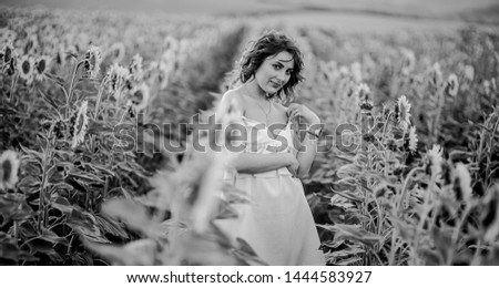 Similar – Woman posing in field of white flowers