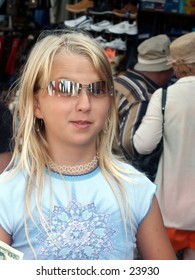 Young girl in sunglasses with that Hey Now! attitude