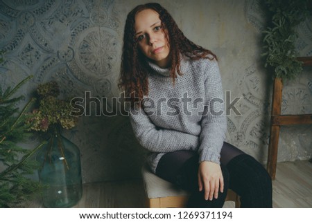 Similar – barefoot young woman sitting barefoot in a window frame