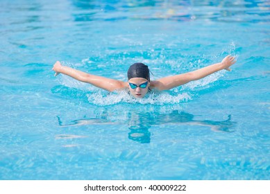 Young Girl Swimming Butterfly Stroke Style