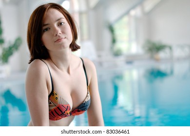 Young girl at the swimming pool (with copy space)