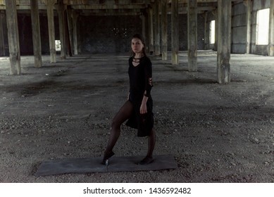 Young girl is sympathetic emotional doing exercises acrobatic movements, are in the premises of an old factory, warehouse, acro - Powered by Shutterstock