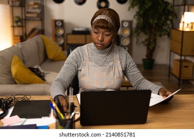 A Young Girl Takes A Break From Work To Write Back Overdue Messages. The Woman Tries To Use The Time Spent At Her Desk Productively And Writes Everything Down So As Not To Forget Anything.