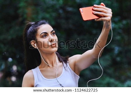 Young girl is taking selfie
