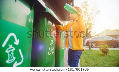Young Girl is Throwing Away an Empty Plastic Bottle into a Trash Bin. She Uses Correct Garbge Bin Because This Family is Sorting Waste and Helping to Save the Environment.