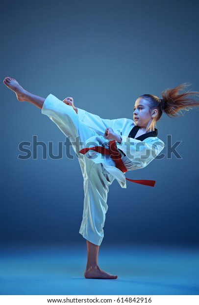 Young Girl Training Karate On Blue Stock Photo 614842916 | Shutterstock