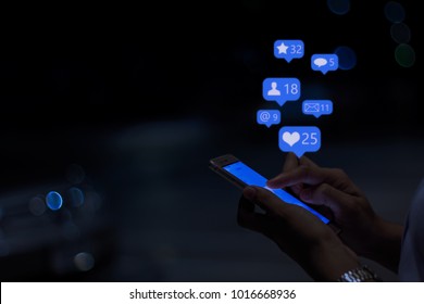 Young girl using smart phone at night
 ,Social media concept. - Powered by Shutterstock