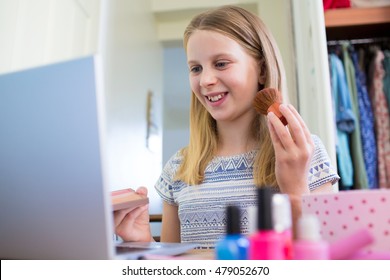 Young Girl Watching On Line Make Up Tutorial