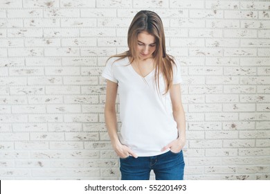 Young girl wearing blank t-shirt.A close-up of young smiling girl wearing blank t-shirt.