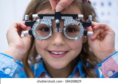 Young girl wearing trial fame in ophthalmology clinic