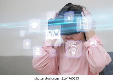 Young Girl Wearing VR Headset, Enjoying Game, Visual Simulation, Learning, Virtual Travelling. Young Girl Using A Computer To Webinar Online, Education On Internet, Online Courses E-learning Concept.