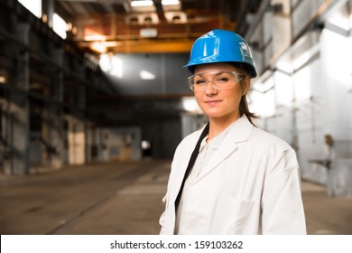 Young Girl Worker In The Factory