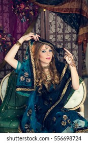 Young Girl Wrapped In Blue Sari With Teak Over Her Head