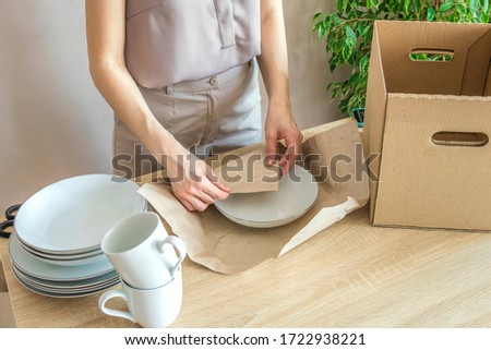Similar – Image, Stock Photo Woman carefully cutting paper design in studio