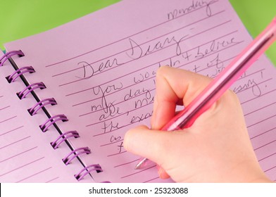 Young Girl Writing In Diary