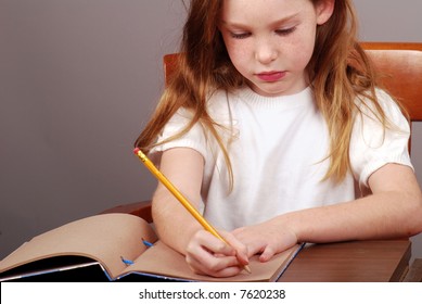 Young Girl Writing In Journal