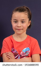 Young Girl In Yearbook Style Portrait Isolated On A Dark Background.