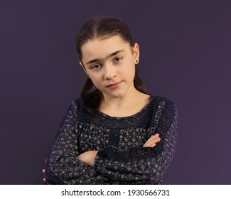 Young Girl In Yearbook Style Portrait Isolated On A Dark Background.