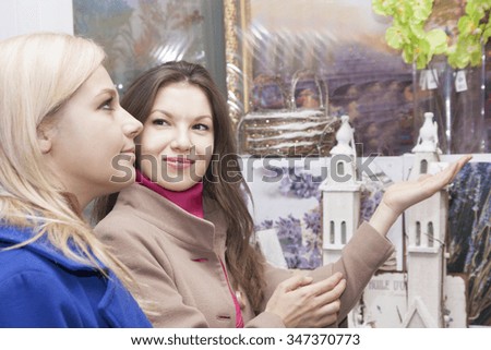 Similar – Image, Stock Photo Twin sisters laughing at a postcard in Erfurt