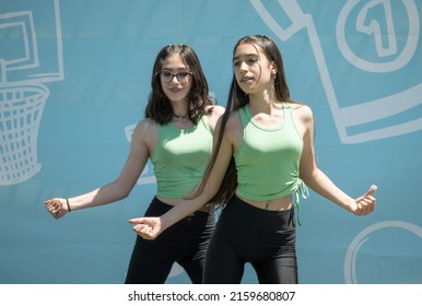 The Young Girls Dance On Stage In An Outdoor Show In The Public Park. Romania, Gorj. May, 22, 2022