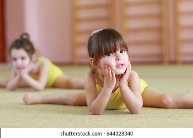Young girls doing gymnastics.
