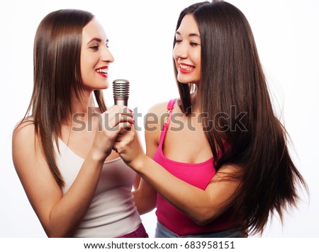 young girls friends with microphone, happy and smile