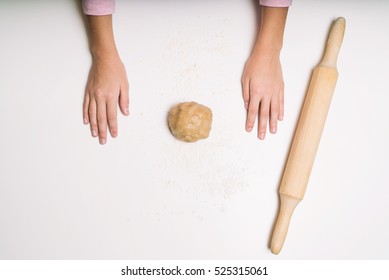 Young Girls Hands Kneading Dough. Christmas Baking Preparation. Close-up Of Child's Hands Baking Cookies. Top View.