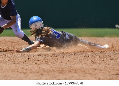 Young Girls Playing The Sport Of Fastpitch Softball