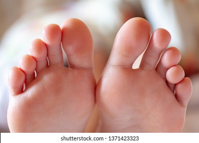 young girl's toes are healthy and beautiful. Well-groomed toes. Concept for medical articles and ointments - the image of the toes and feet. Image of legs with space for inscriptions and advertising. - Shutterstock ID 1371423323