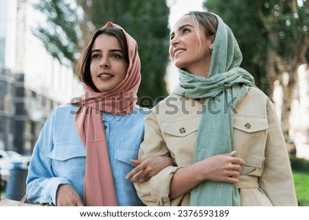 Young girls walking in the city.