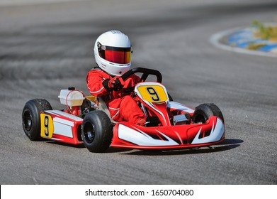 Young Go Cart Racer On Circuit