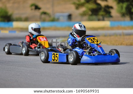 Young go cart racer on circuit
