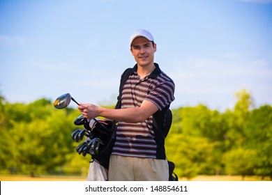 Young Golfer Ready to Swing Club Early Morning  under Summer Blue Sky - Powered by Shutterstock