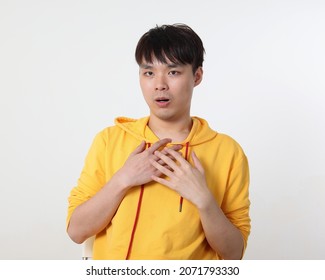 Young Good Looking Asian Chinese Malay Man Pose Face Body Expression Mode Emotion On White Background Like Love Shock Hand On Chest