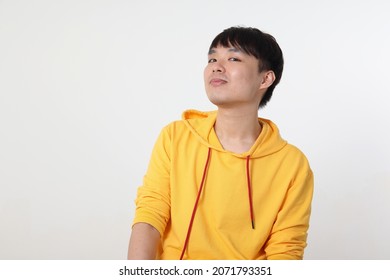 Young Good Looking Asian Chinese  Man Pose Face Body Expression Mode Emotion On White Background Witty Funny Smile Ah Ha Moment