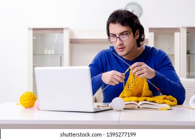 Young Good Looking Man Knitting At Home