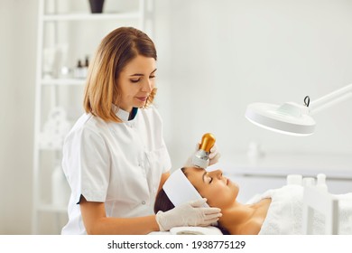 Young good looking woman enjoying mesotherapy ultrasonic skin rejuvenation procedure - Powered by Shutterstock