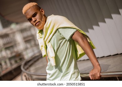 Young Good-looking Man With Dyed Hair Looking Confident