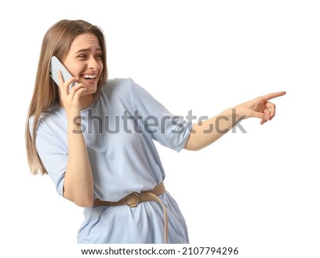 Young gossiping woman with mobile phone on white background