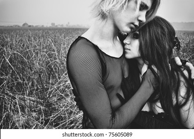 Young Goth Couple Outdoors Portrait. Black And White.