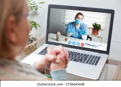 Young GP Physician And Elderly Female Patient Consulting Over Video Call,virtual Medical Health Check-up,doctor Televisit Instead Of In-office Appointment During COVID-19 Pandemic Outbreak Lockdown 