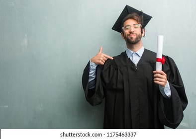 Young Graduated Man Against Grunge Wall Stock Photo 1175463337 ...