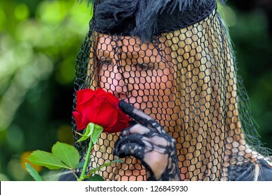 A Young, Grieving Widow With A Veil And Rose. Death And Inheritance.