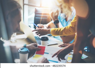 Young Group Coworkers Making Great Business Decisions.Marketing Team Discussion Corporate Work Concept Studio.New Startup Creative Idea Presentation Laptop.People Working Wood Table Documents.Blurred