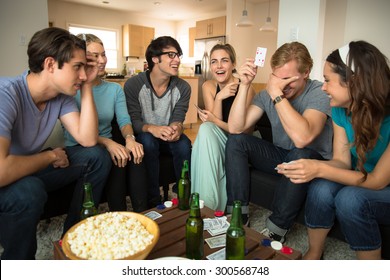 Young Group Of Friends Attractive People Laughing Embarrassed Poker Player Card Game Night Loser Winner