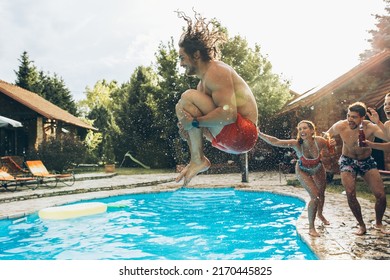 A young group of friends jumping into the swimming pool.Having fun and refreshing on a hot summer day.	
 - Powered by Shutterstock