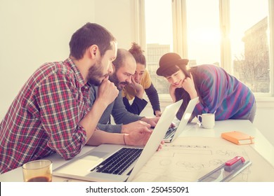 Young Group Of People/architects Discussing Business Plans.