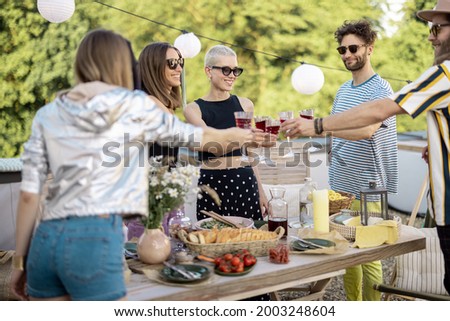 Similar – Freunde essen Kuchen und haben Spaß auf der Party.